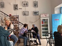 We stop for coffee waiting for the rain to lighten - photographs for sale are priced as if in the US.