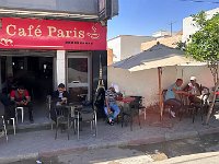 Passing a typical cafe - with men hard at work.