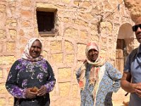 The two sisters who own the house, living there with their mother, and run a restaurant for travelers.