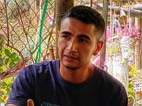 Juaquin, ex-paramilitary, The Hill of Values teaching neighbors about recycling, farming, etc.
