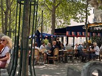 I left never finding the 'famous' tombs'.  resting my feet on Rue de la Roquette.
