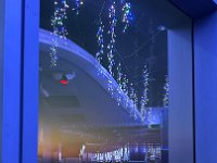 reflection of sunset with Xmas lights  in the 87th floor bar.