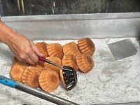 Removing the baked cakes from the molds