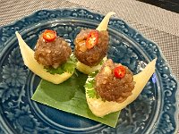 Amuse-bouches: peanut balls on pinapple eith parsley and tiny chilis - were good & killer chilis.