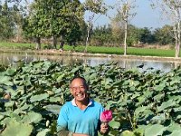 And now continuing our tour of rural Thailand, we stop at a Lotus farm - This smiling man is the owner and takes us through the processes of lotus harvesting.  I listen some and look at the rice fields filled with birds.