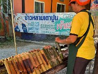 Then we stop at a Sticky Rice stand at a very rural crossroads.  Different types are arranged in bamboo tubes for sale.